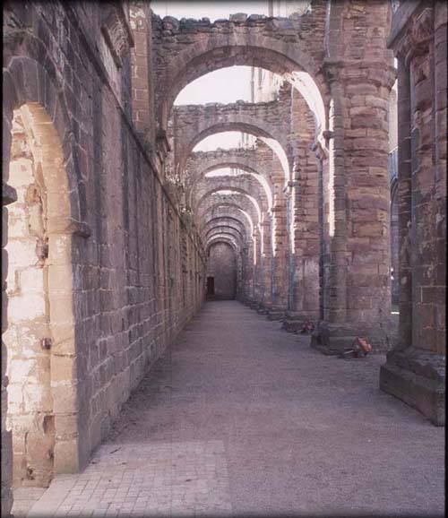 Photograph showing the nave south aisle from east of the abbey church at Fountains