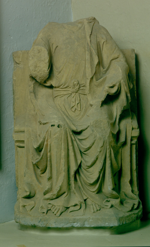 Headless stone carving of Christ in Majesty
              from Rievaulx Abbey