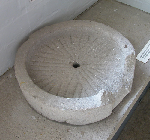 Quern base; lower half of handmill used to grind corn. Found in kitchen at Byland