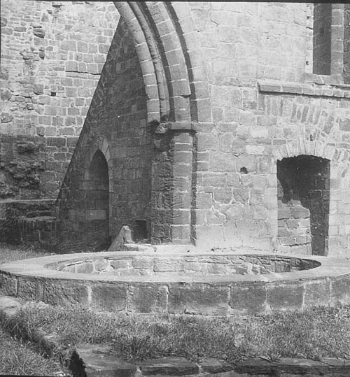 Base of large vat for brewing beer or dovec?te at the entrance to the laybrothers' lane at Kirkstall Abbey.
