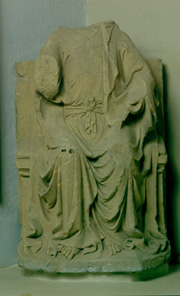 Headless stone carving of Christ in Majesty