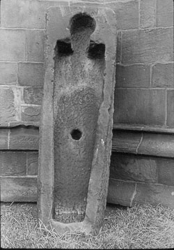 Stone coffin at Kirkstall Abbey with hole in the bottom