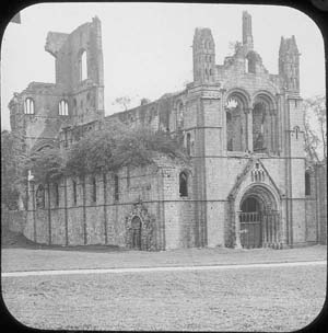The church at Kirkstall Abbey seen from the north west showing vegetation on the ruins. Photograph taken before the programme of conservation in 1892-6.